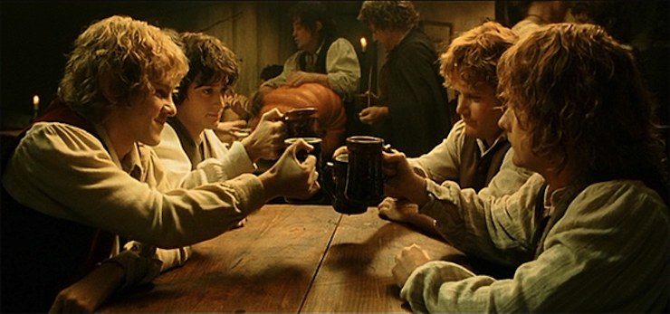 Hobbits toasting their mugs of ale